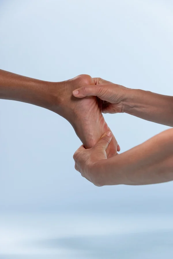 Clinician assessing joint movement with the foot supported